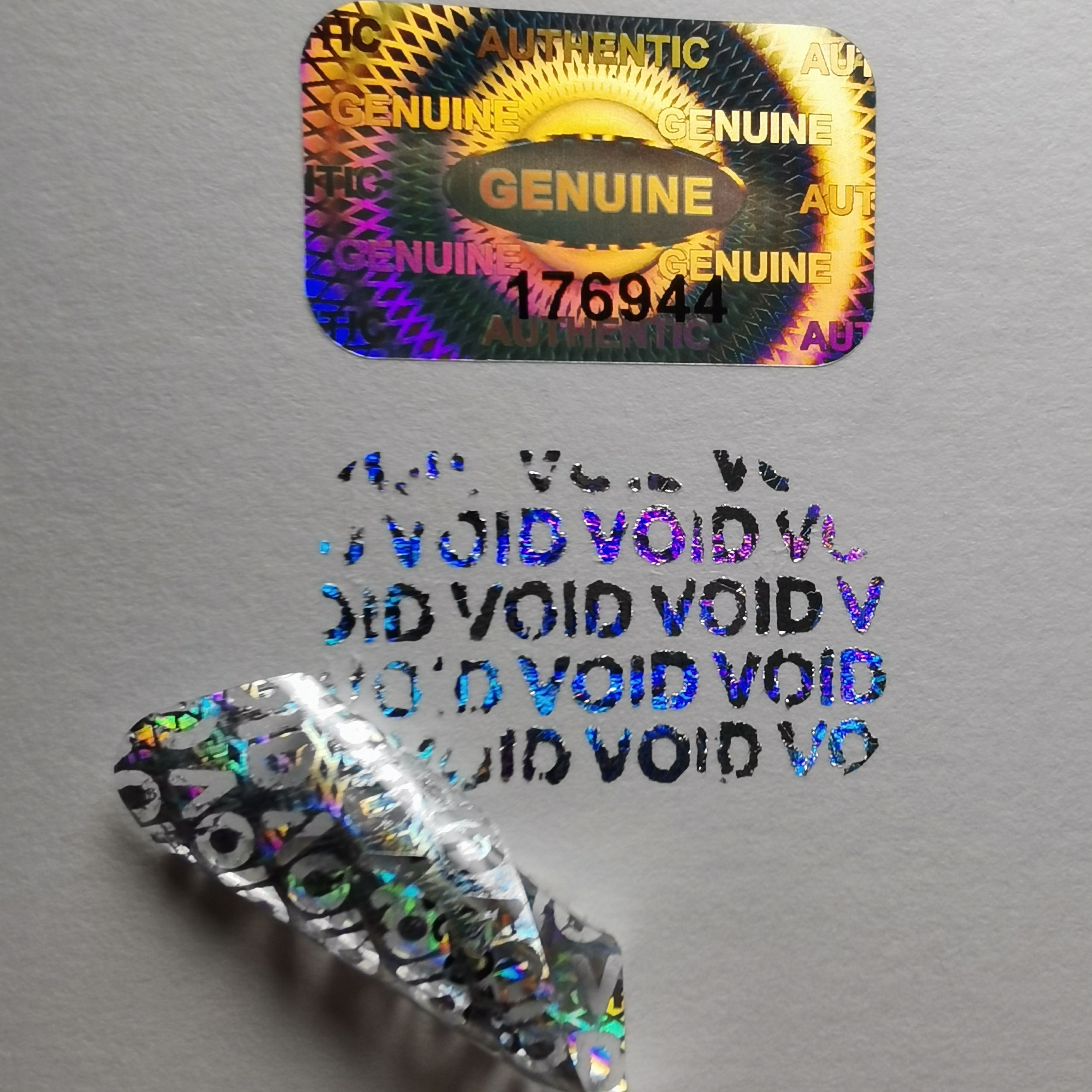 Holografiskt klistermärke för VOID-meddelande
