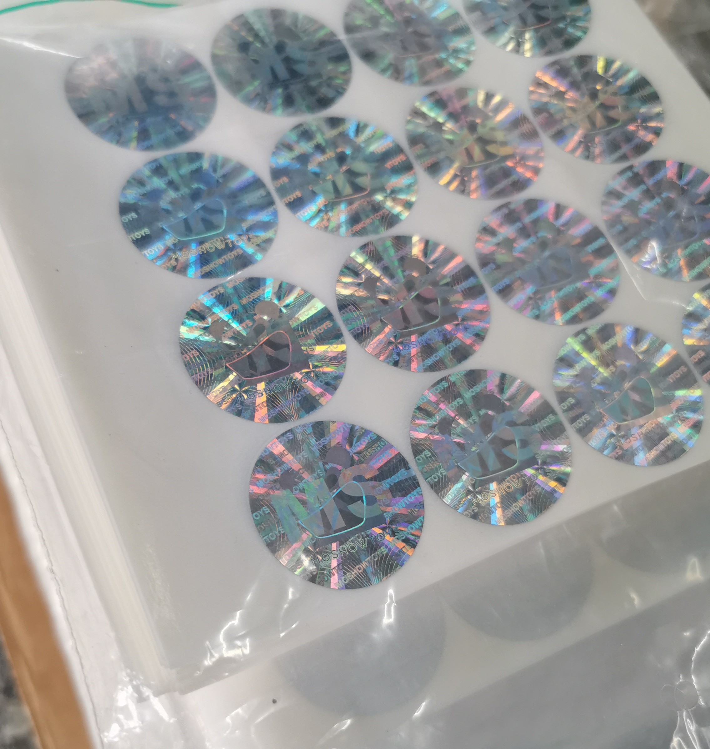 Dual channel holographic sticker