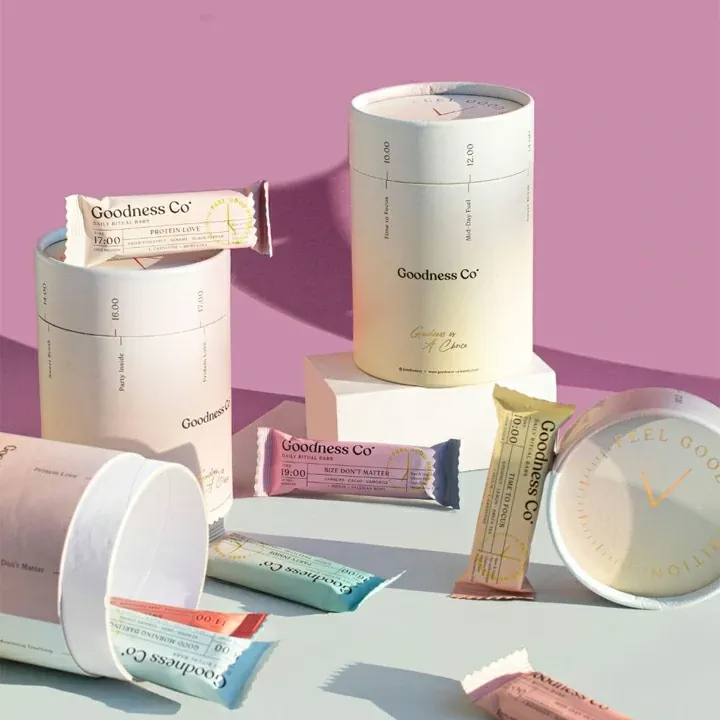Custom branded paper tube packaging for tea with gold foil printing