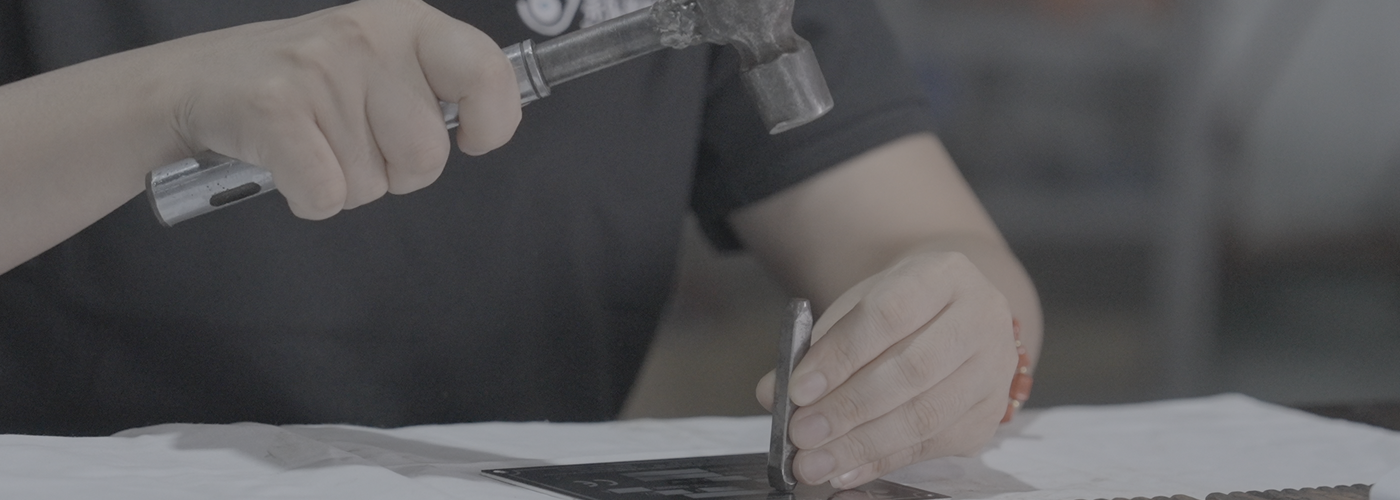 Hand-stamping the nameplate