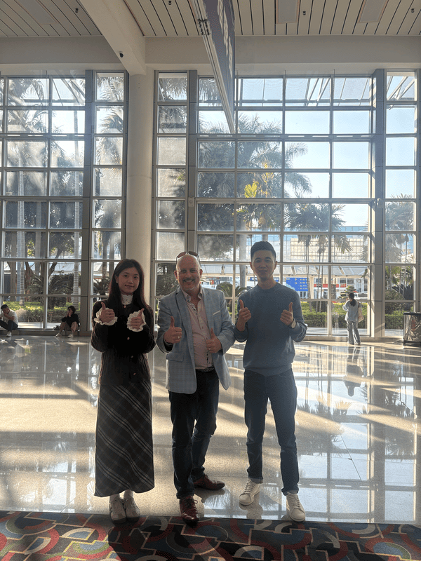 Zhuliyuan team and German client thumbs up at Xiamen Conference Center