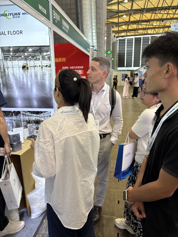 International attendees learning about ZHULIYUAN UHPC high-performance concrete solutions at WOCA 2026