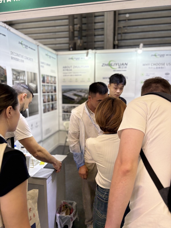 ZHULIYUAN team discussing UHPC panel solutions with global clients at WOCA 2026 booth W5S58
