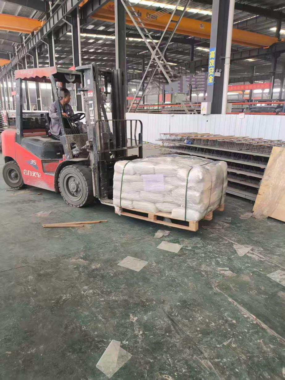 Palletized Zhuliyuan UHPC premix loaded by forklift for shipment to Europe