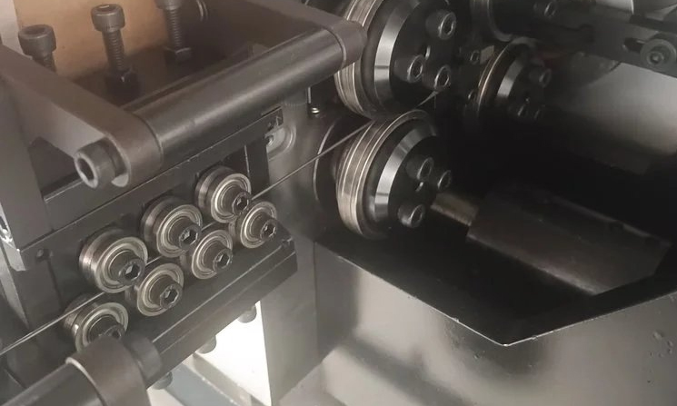 Automotive seat cushion wire spring bending