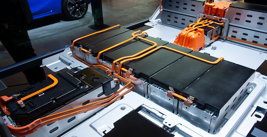 Coated high-voltage busbars routed through an EV battery pack, where insulation cracking is a functional failure