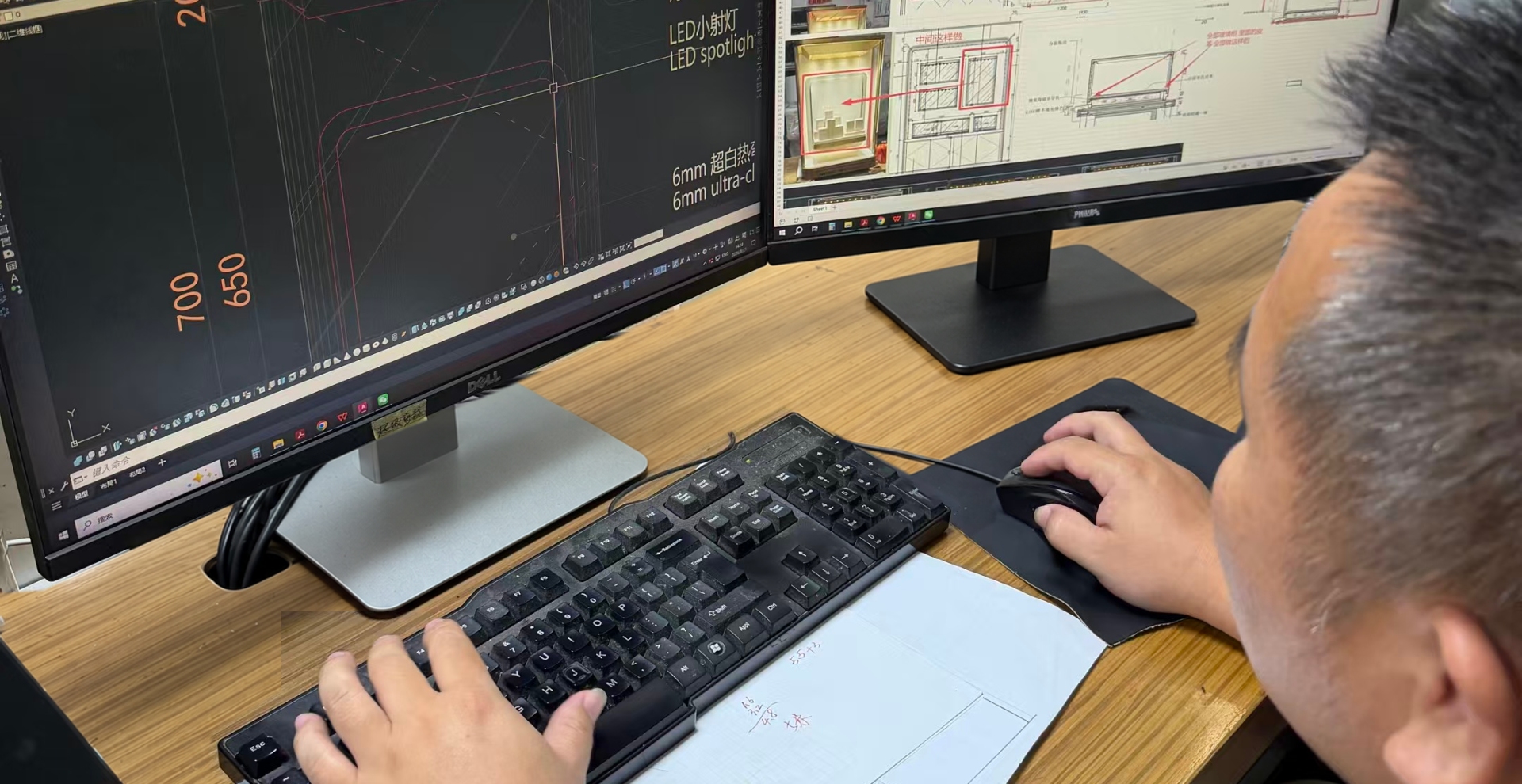 Shangyuan Showcase technical development team reviewing custom retail fixture drawings
