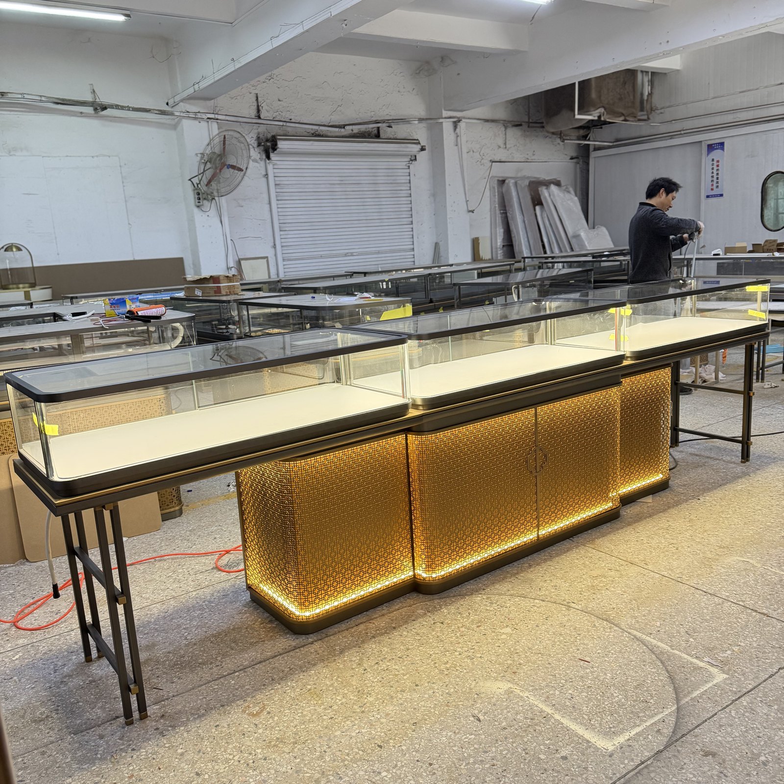 Jewelry showcases with installed glass panels during factory inspection