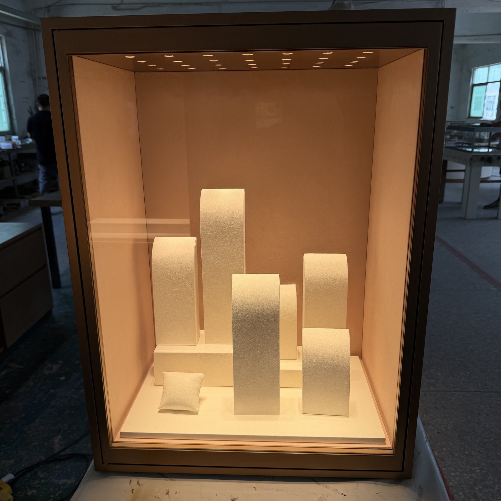 Representative lit jewelry display section used to approve lighting and finishes