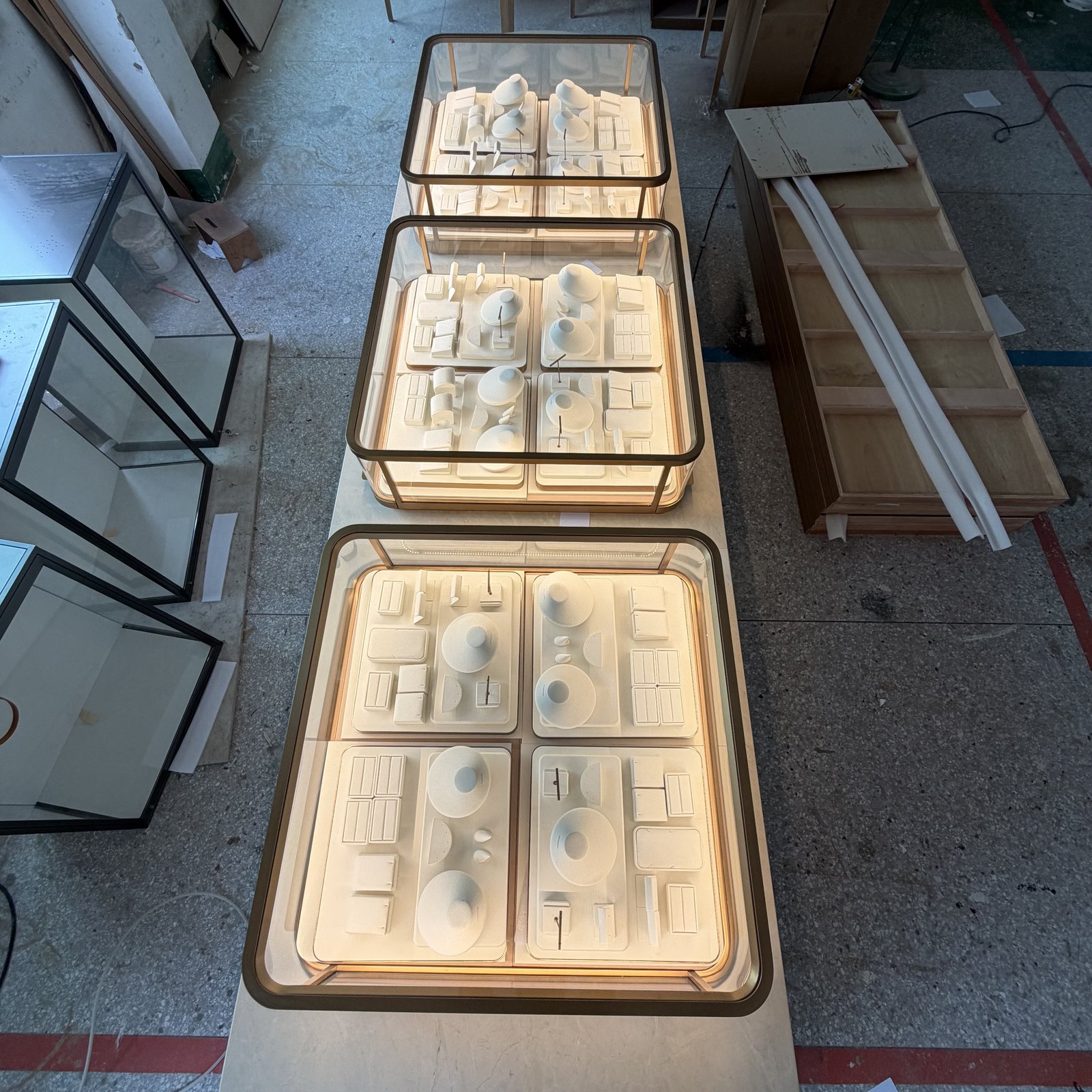 Jewelry showcases on transport carts during factory assembly checks