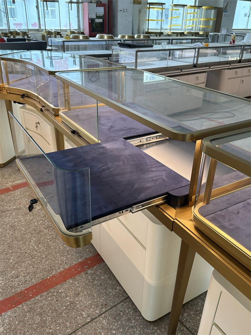 Display tray pulled out from a jewelry counter toward the staff side