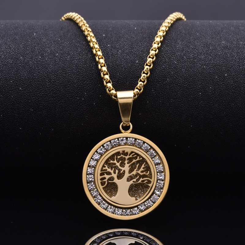 Close up detail of zircon Tree of Life pendant with gold plated stainless steel finish PVD Gold Plated Tree of Life Pendant Detail
